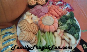 Fall harvest party appetizer platter image with pumpkin stuffed with dip